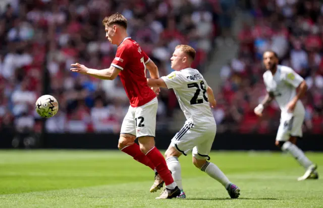 Crewe's Ed Turns and Crawley's Adam Campbell battle for possession