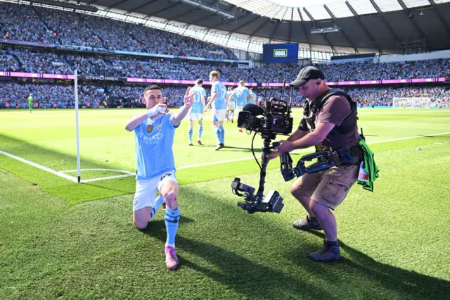 Phil Foden of Manchester City celebrates scoring his team's first goal during the Premier League match between Manchester City and West Ham United at Etihad Stadium