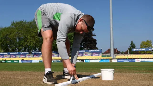 Groundsman paints lines at Grace Road