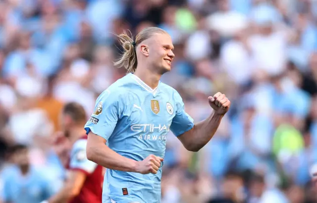 Erling Haaland of Manchester City celebrates victory , as Manchester City are named Champions of the Premier League following victory during the Premier League match between Manchester City and West Ham United at Etihad Stadium