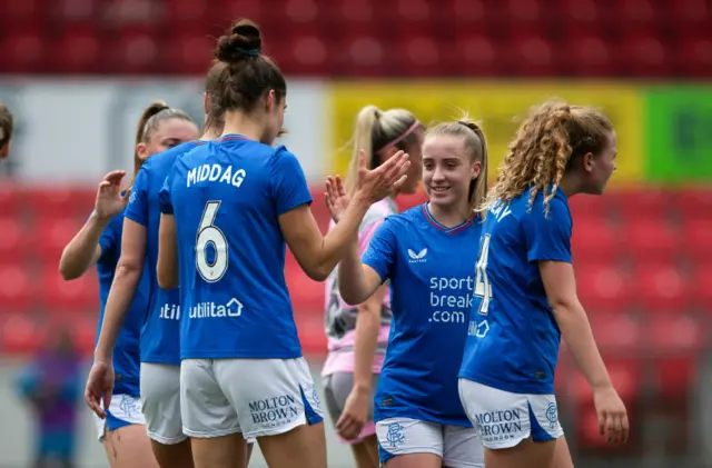 Rangers' Tessel Middag (L) celebrates with Kirsty MacLean after scoring to make it 2-0 during a Scottish Power Women's Premier League match between Rangers and Partick Thistle at Broadwood Stadium, on May 19, 2024, in Glasgow, Scotland.