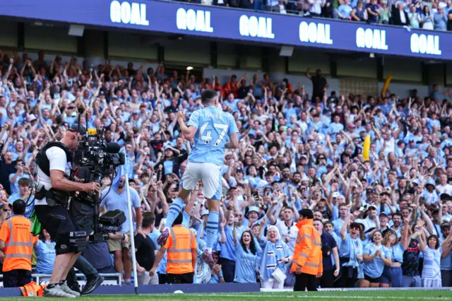 Phil Foden of Manchester City celebrates after scoring a goal to make it 2-0 during the Premier League match between Manchester City and West Ham United at Etihad Stadium