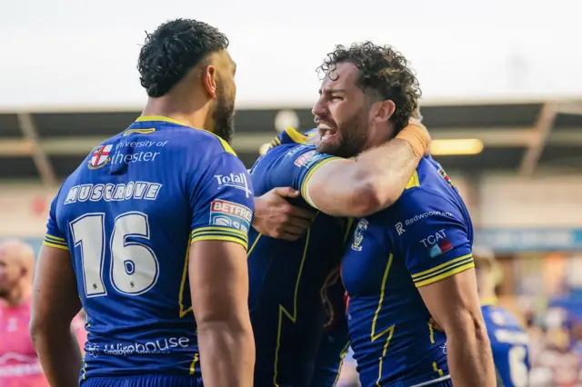 Warrington's Toby King of Warrington celebrates with Zane Musgrove and Lachlan Fitzgibbon