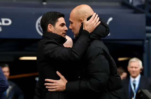 Mikel Arteta and Pep Guardiola embrace