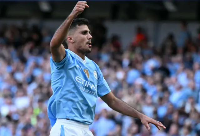 Manchester City's Spanish midfielder #16 Rodri celebrates scoring the team's third goal during the English Premier League football match between Manchester City and West Ham United at the Etihad Stadium