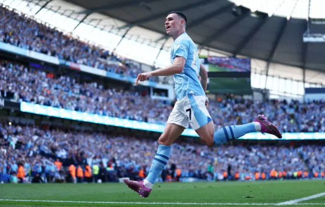 Phil Foden of Manchester City celebrates scoring his team's second goal during the Premier League match between Manchester City and West Ham United at Etihad Stadium