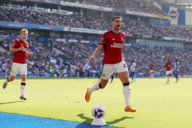 Diogo Dalot of Manchester United celebrates scoring his team's first goal during the Premier League match between Brighton & Hove Albion and Manchester United at American Express Community Stadium