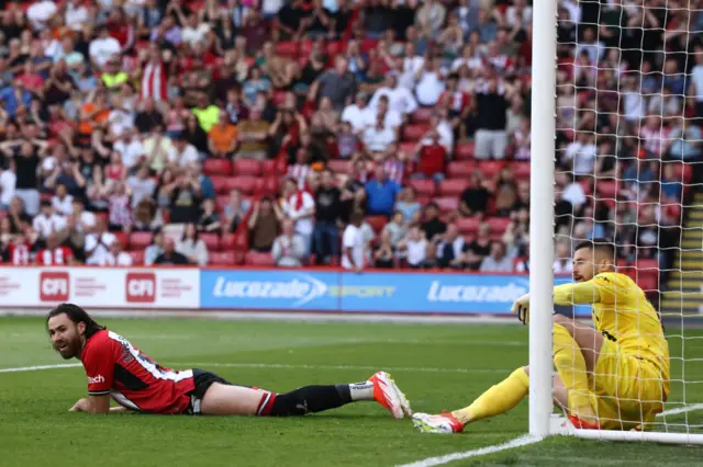 Sheffield United's Chilean striker #11 Ben Brereton Diaz (L) reacts after failing to score past Tottenham Hotspur's Italian goalkeeper #13 Guglielmo Vicario (R) during the English Premier League football match between Sheffield United and Tottenham Hotspur at Bramall Lane