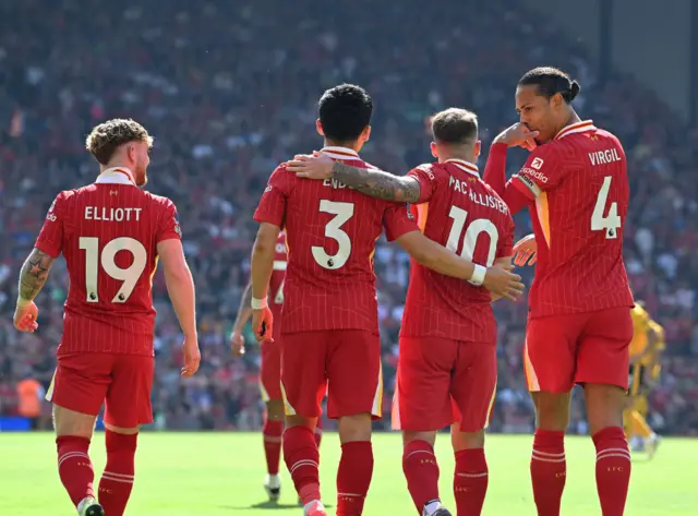 Alexis Mac Allister of Liverpool celebrates after scoring the opening goal during the Premier League match between Liverpool FC and Wolverhampton Wanderers