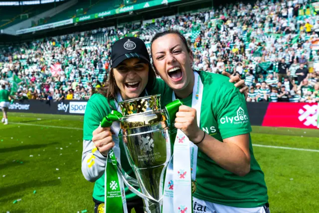 Celtic Head Coach Elena Sadiku  and  Amy Gallacher  celebrate with the SWPL Trophy during a Scottish Power Women's Premier League match between Celtic and Hibernian at Celtic Park, on May 19, 2024, in Glasgow, Scotland.