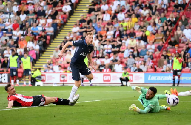 : Dejan Kulusevski of Tottenham Hotspur scores his team's third goal past Wes Foderingham of Sheffield United during the Premier League match between Sheffield United and Tottenham Hotspur at Bramall Lane