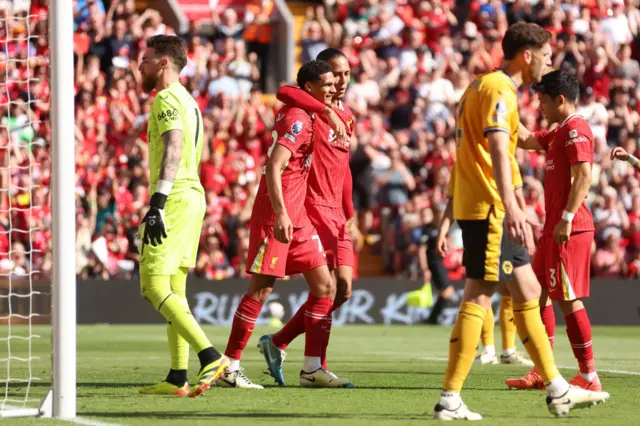 Jarell Quansah of Liverpool celebrates scoring his team's second goal with teammate Virgil van Dijk during the Premier League match between Liverpool FC and Wolverhampton Wanderers at Anfield