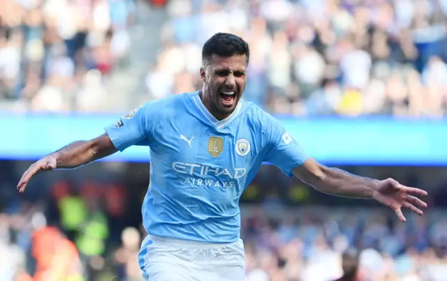 Rodri of Manchester City celebrates scoring his team's third goal during the Premier League match between Manchester City and West Ham United at Etihad Stadium