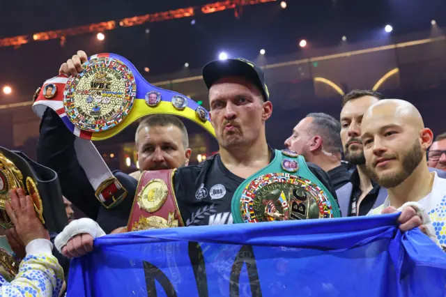 Oleksandr Usyk with all his belts