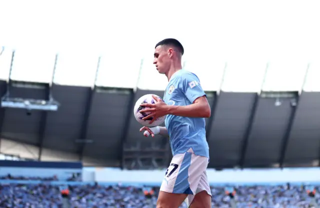 Phil Foden of Manchester City prepares to take a corner kick during the Premier League match between Manchester City and West Ham United