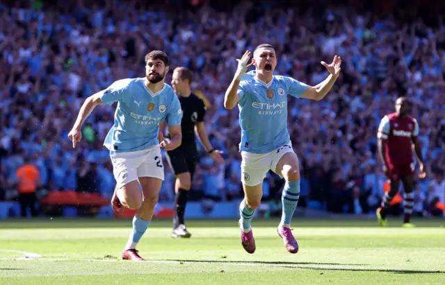 Phil Foden of Manchester City celebrates after scoring the opening goal during the Premier League match between Manchester City and West Ham United at Etihad Stadium