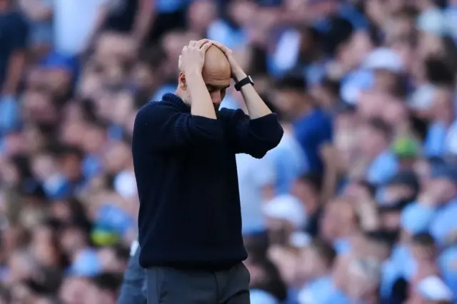 : Pep Guardiola, Manager of Manchester City, reacts during the Premier League match between Manchester City and West Ham United at Etihad Stadium