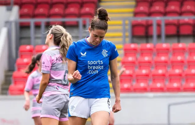 Rangers' Tessel Middag (L) celebrates with Kirsty MacLean after scoring to make it 2-0 during a Scottish Power Women's Premier League match between Rangers and Partick Thistle at Broadwood Stadium, on May 19, 2024, in Glasgow, Scotland.