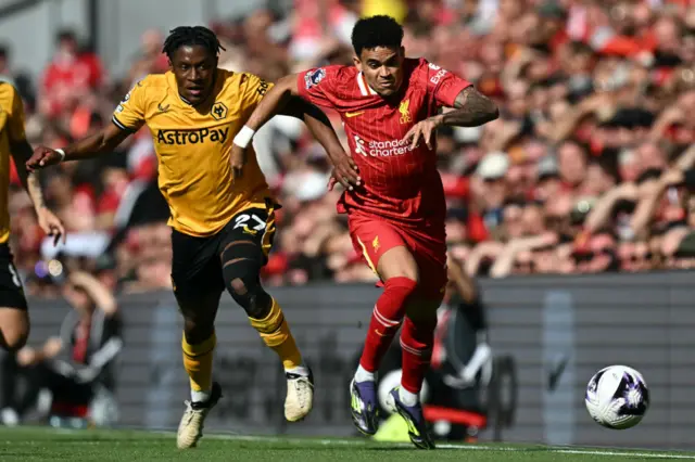 Wolverhampton Wanderers' French midfielder #27 Jeanricner Bellegarde (L) vies with Liverpool's Colombian midfielder #07 Luis Diaz (R) during the English Premier League football match between Liverpool and Wolverhampton Wanderers at Anfield