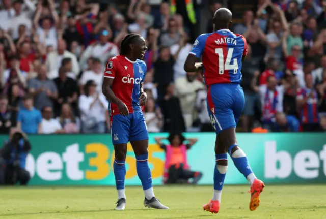 Eberechi Eze of Crystal Palace celebrates scoring his team's fifth goal with teammate Jean-Philippe Mateta during the Premier League match between Crystal Palace and Aston Villa at Selhurst Park on May 19, 2024 in London, England