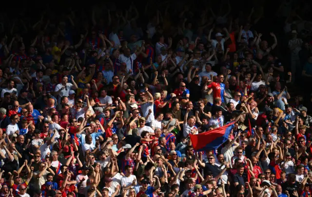 Crystal Palace fans celebrate after Jean-Philippe Mateta of Crystal Palace (not pictured) scores his team's fourth goal during the Premier League match between Crystal Palace and Aston Villa at Selhurst Park