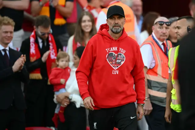 Liverpool's German manager Jurgen Klopp comes out for a final fairwell after the English Premier League football match between Liverpool and Wolverhampton Wanderers at Anfield in Liverpool