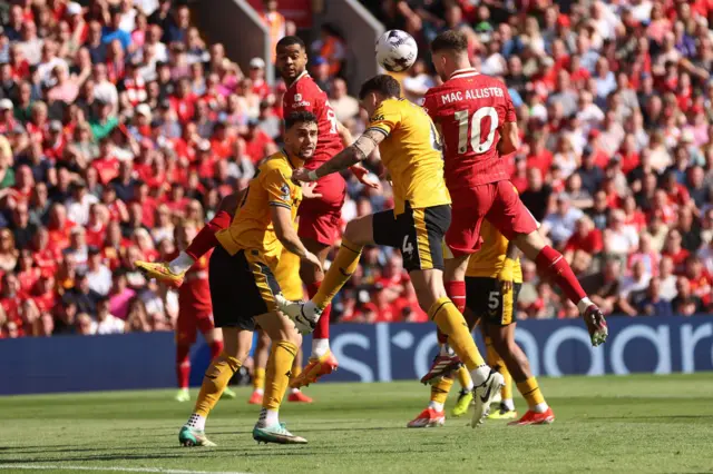 Alexis Mac Allister of Liverpool scores his team's first goal during the Premier League match between Liverpool FC and Wolverhampton Wanderers at Anfield