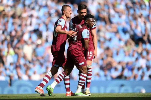 Mohammed Kudus of West Ham United celebrates scoring his team's first goal with teammates Tomas Soucek and Konstantinos Mavropanos of West Ham United during the Premier League match between Manchester City and West Ham United at Etihad Stadium