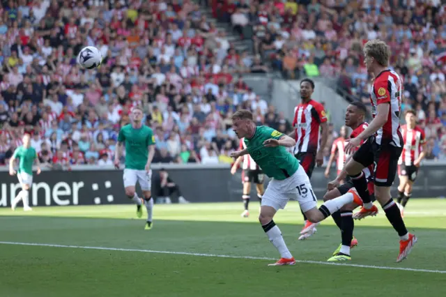 Harvey Barnes of Newcastle United scores his team's first goal during the Premier League match between Brentford FC and Newcastle United at Brentford Community Stadium