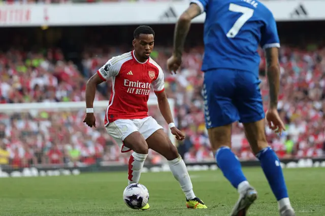 Jurrien Timber (L) vies with Everton's English midfielder Dwight McNeil