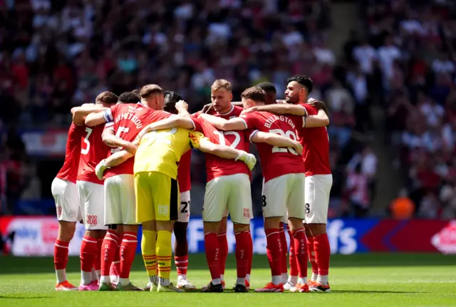 Crewe players in a huddle before kick-off