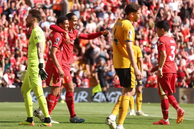 Jarell Quansah of Liverpool celebrates scoring his team's second goal with teammate Virgil van Dijk during the Premier League match between Liverpool FC and Wolverhampton Wanderers at Anfield