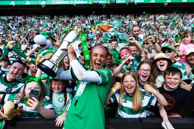 Celtic’s Caitlin Hayes celebrates with the SWPL Trophy during a Scottish Power Women's Premier League match between Celtic and Hibernian at Celtic Park, on May 19, 2024, in Glasgow, Scotland.