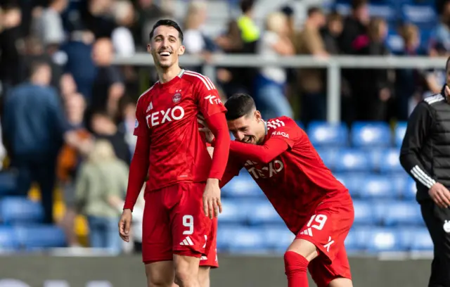 Aberdeen's Bojan Miovski (L) and Slobodan Rubezic at full time during a cinch Premiership match between Ross County and Aberdeen at the Global Energy Stadium, on May 19, 2024, in Dingwall, Scotland.