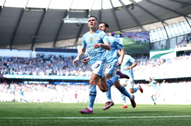 Phil Foden of Manchester City celebrates scoring his team's second goal during the Premier League match between Manchester City and West Ham United at Etihad Stadium