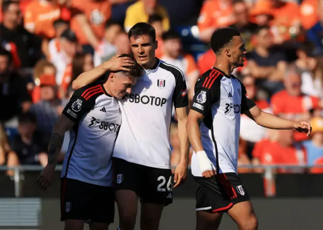 Harry Wilson of Fulham celebrates scoring his team's fourth goal with teammate Joao Palhinha during the Premier League match between Luton Town and Fulham FC