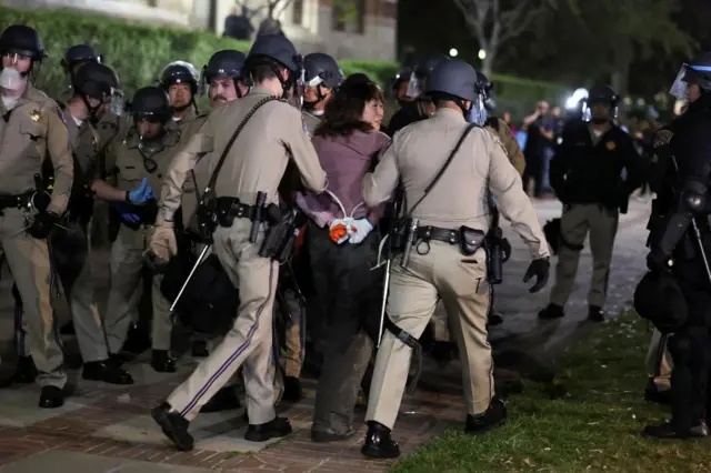 Law enforcement officers are detaining protesters at UCLA