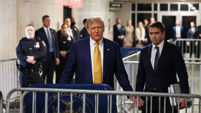 Donald Trump speaks to media outside the courtroom in New York where his hush-money trial is held