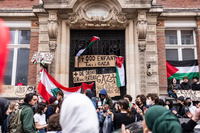 Students block the entrance of the ESJ Superior School of Journalism in Lille, France during a pro-Palestinian solidarity demonstration.