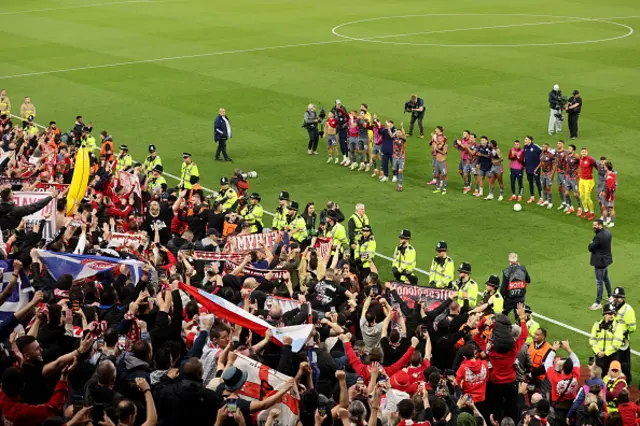 A general view as players of Olympiakos applaud the fans