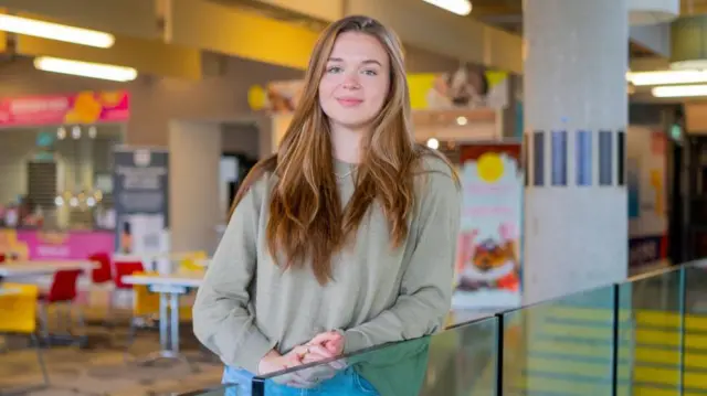 A girl in a student union building