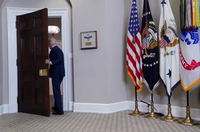 US President Joe Biden departs the Roosevelt Room after speaking about student protests