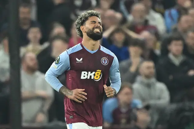 Douglas Luiz reacts after missing a penalty