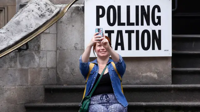 A voter takes a selfie photo at a polling station in London, U.K., on Thursday, June 8, 2017