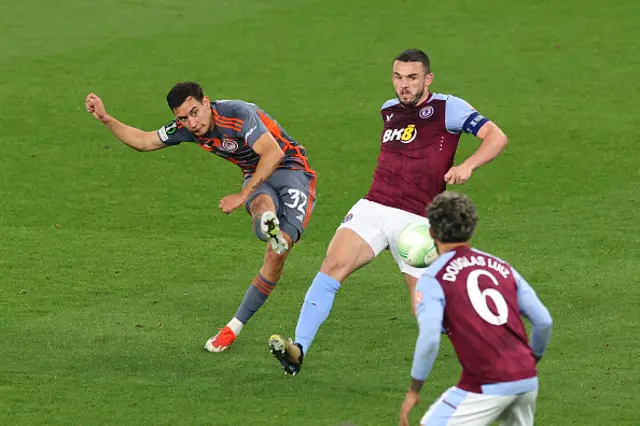 Santiago Hezze of Olympiakos shoots from range