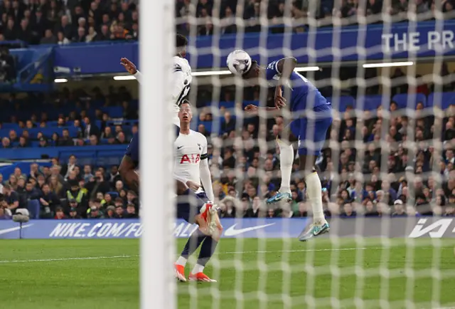 Trevoh Chalobah of Chelsea scores his team's first goal with a header whilst under pressure from Emerson