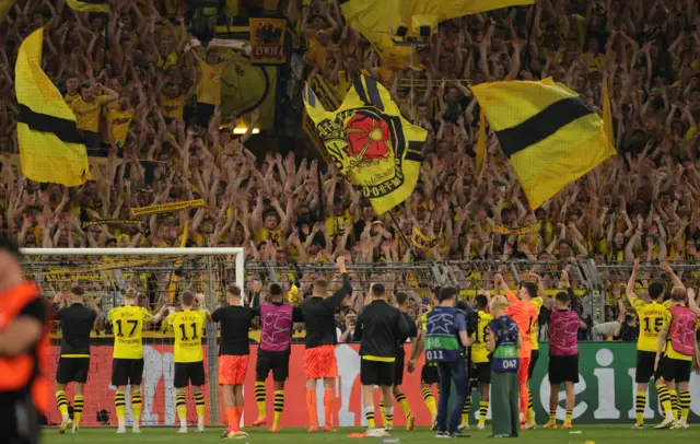 Borussia Dortmund players salute the Yellow Wall