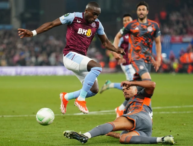 Olympiacos' David Carmo (right) tackles Aston Villa's Moussa Diaby