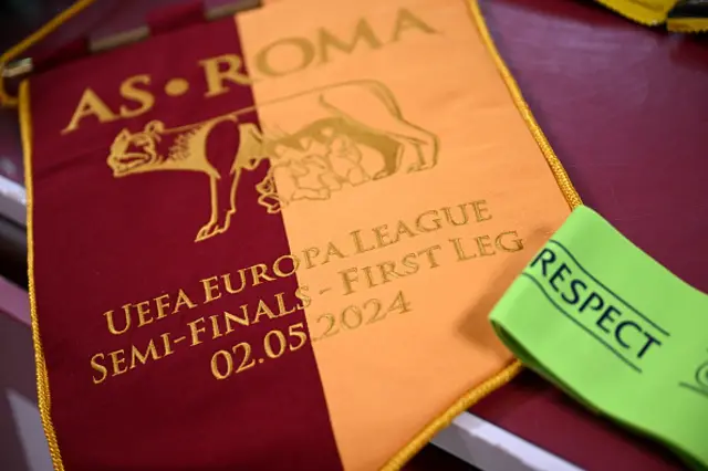 A detailed view of the match pennant is seen alongside the UEFA Respect Captain's Armband