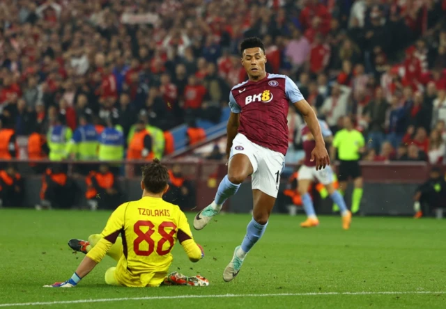 Aston Villa's Ollie Watkins in action with Olympiacos' Konstantinos Tzolakis